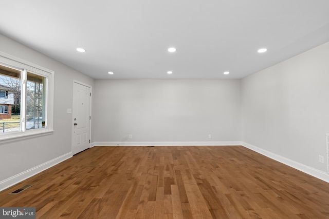 unfurnished room featuring wood-type flooring