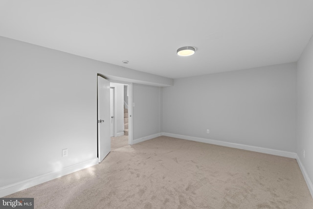 spare room with light carpet