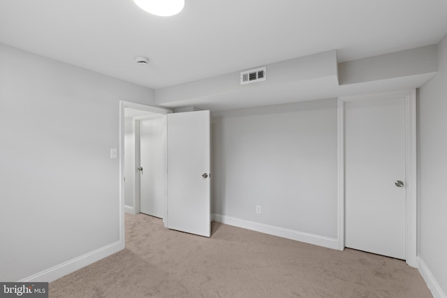 unfurnished bedroom with light colored carpet