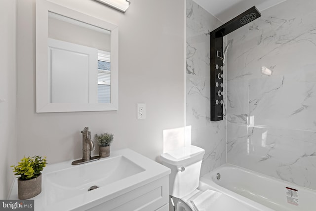 full bathroom featuring vanity, tiled shower / bath combo, and toilet