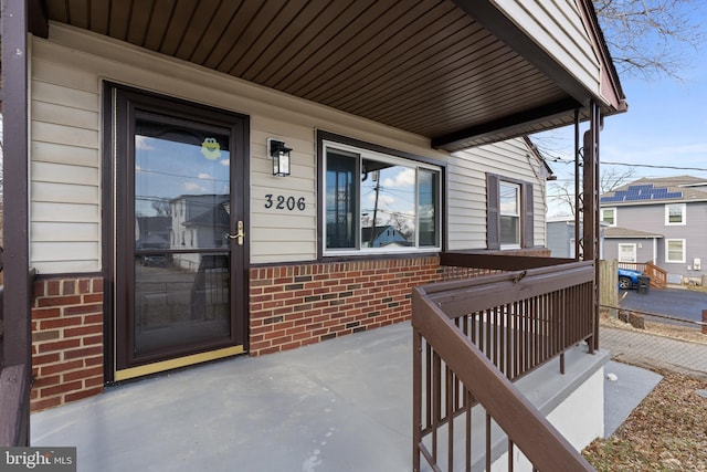 doorway to property featuring a porch