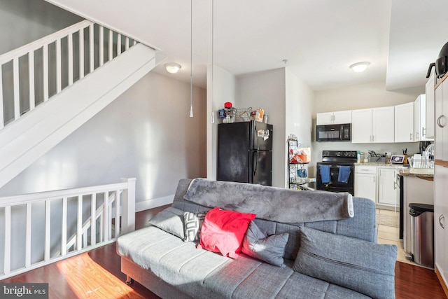 living room featuring dark hardwood / wood-style flooring