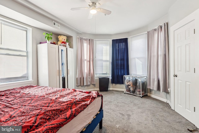 carpeted bedroom with ceiling fan