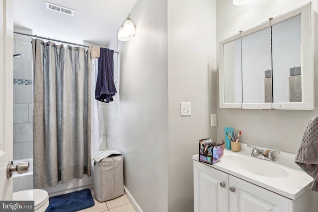 full bathroom featuring vanity, toilet, tile patterned flooring, and shower / bath combo with shower curtain