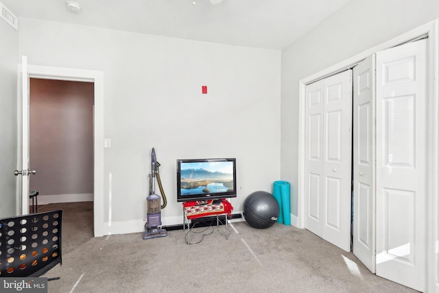 workout room with light carpet