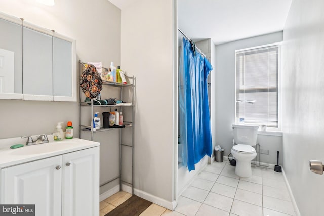 full bathroom with vanity, tile patterned floors, shower / bath combo with shower curtain, and toilet