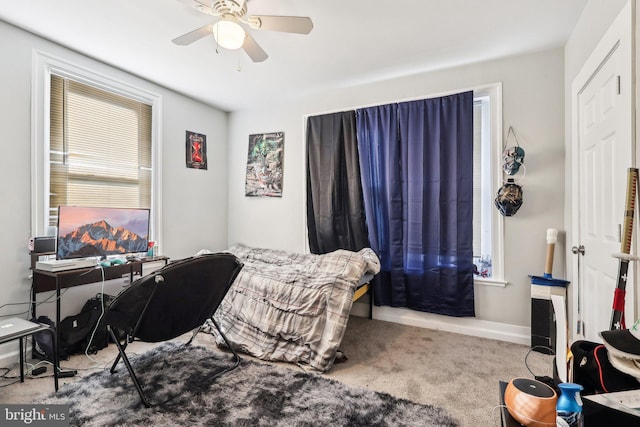 carpeted bedroom featuring ceiling fan