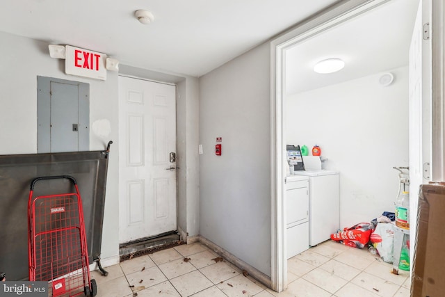 foyer entrance with electric panel and independent washer and dryer