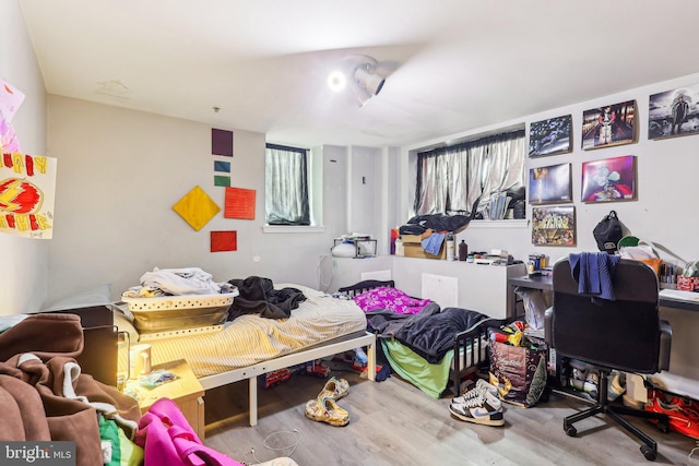 bedroom featuring hardwood / wood-style floors