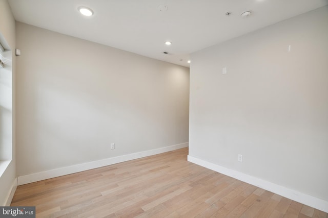 spare room featuring light hardwood / wood-style flooring