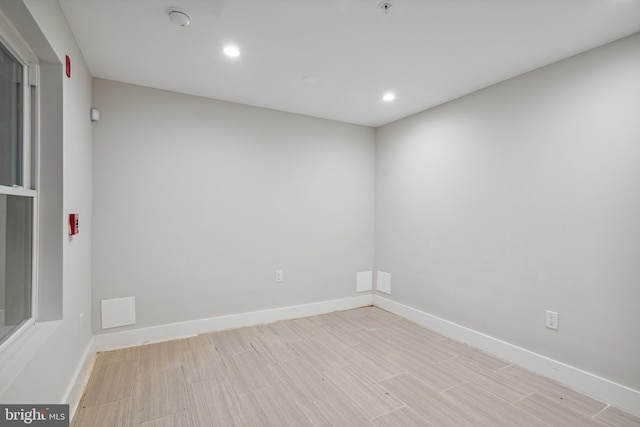 spare room featuring light hardwood / wood-style flooring