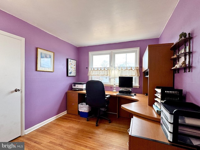 office area with light hardwood / wood-style floors