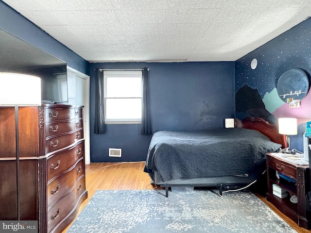 bedroom with light hardwood / wood-style flooring