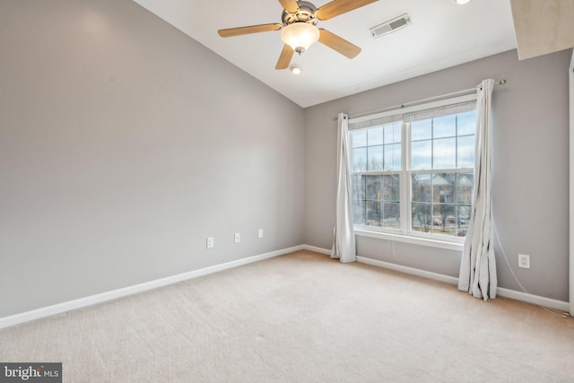 unfurnished room featuring vaulted ceiling, carpet flooring, visible vents, and baseboards