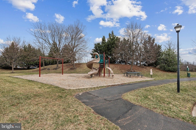 communal playground featuring a yard