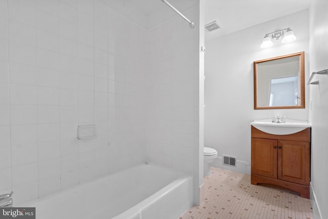 bathroom featuring vanity, tile patterned flooring, and toilet