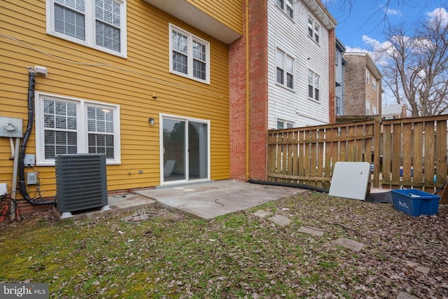 rear view of property with central AC and a patio area