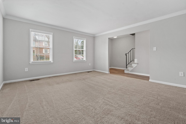 carpeted empty room with crown molding