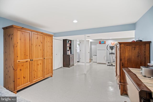 hall with washer / clothes dryer