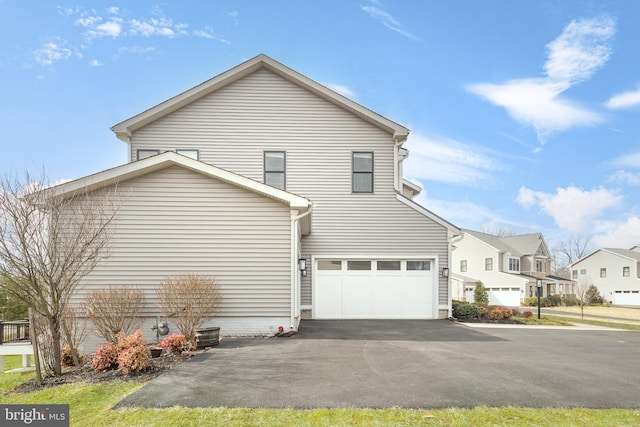 view of side of property featuring a garage