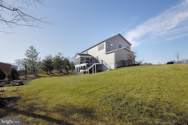 view of yard with a wooden deck and a sunroom