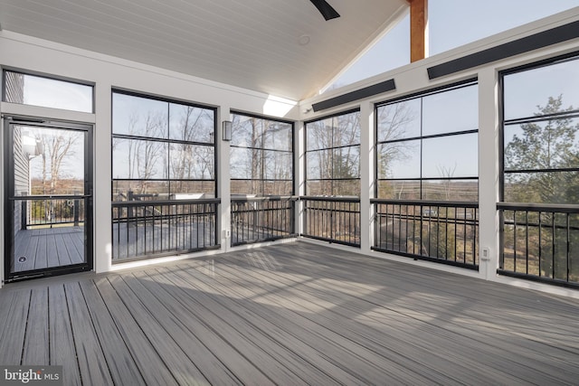 unfurnished sunroom with lofted ceiling and a wealth of natural light