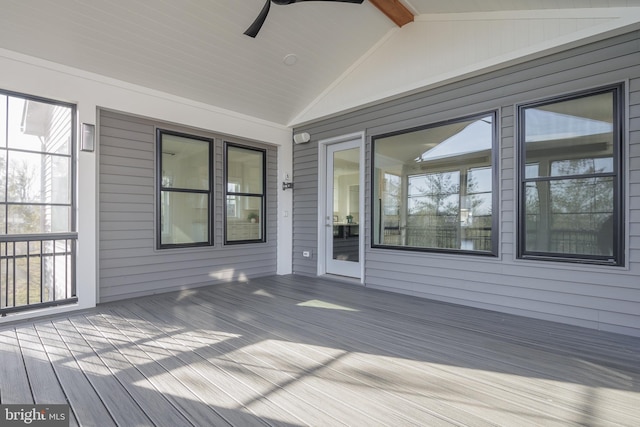 wooden terrace featuring ceiling fan