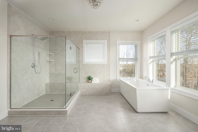 bathroom featuring separate shower and tub and tile patterned floors