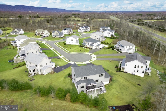 birds eye view of property featuring a mountain view