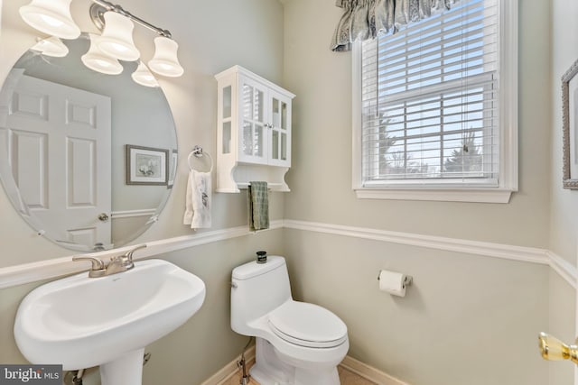 bathroom with toilet and sink