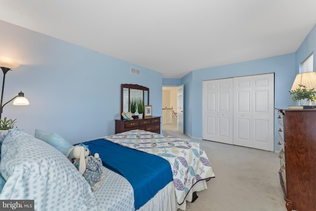 carpeted bedroom with a closet