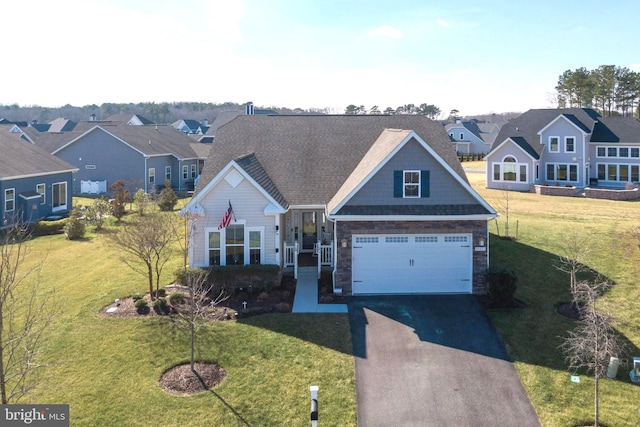 view of front of house featuring a garage and a front yard