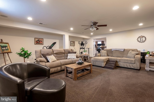 carpeted living room featuring ceiling fan