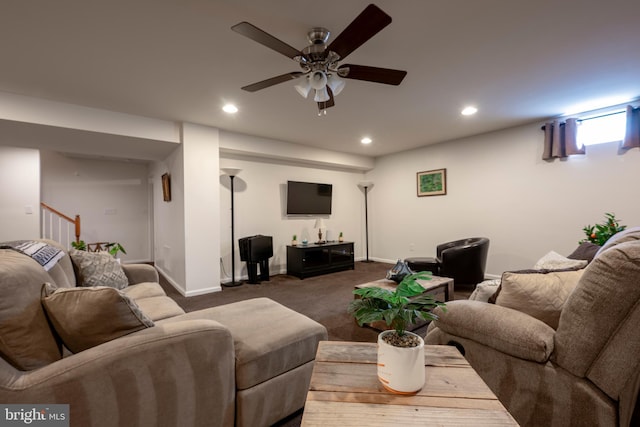 carpeted living room with ceiling fan