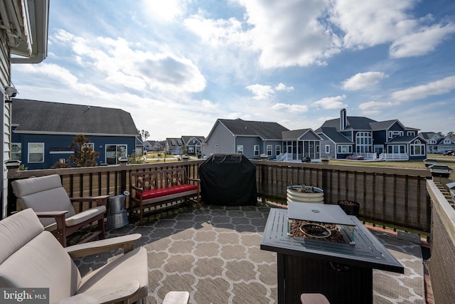 view of patio featuring a grill and a fire pit