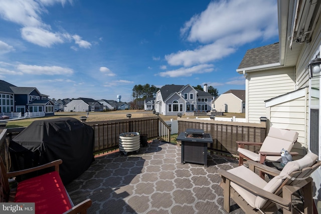 view of patio featuring area for grilling and a fire pit