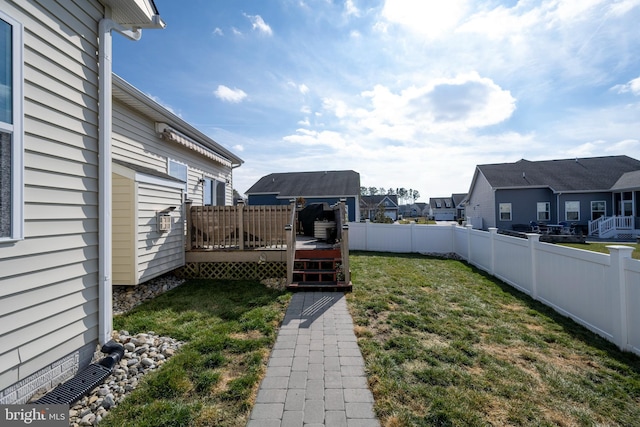 view of yard featuring a wooden deck