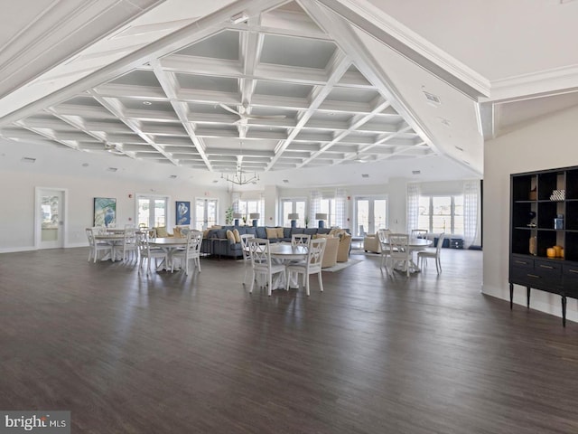 unfurnished dining area featuring beam ceiling, coffered ceiling, and dark hardwood / wood-style flooring