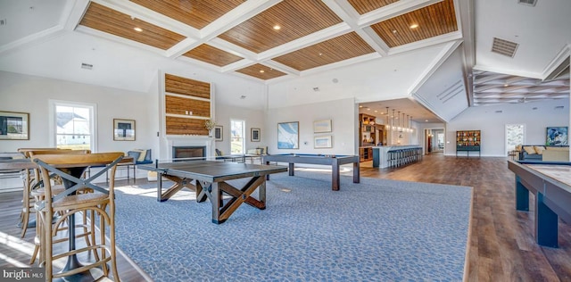 recreation room featuring dark wood-type flooring, billiards, coffered ceiling, beamed ceiling, and a towering ceiling