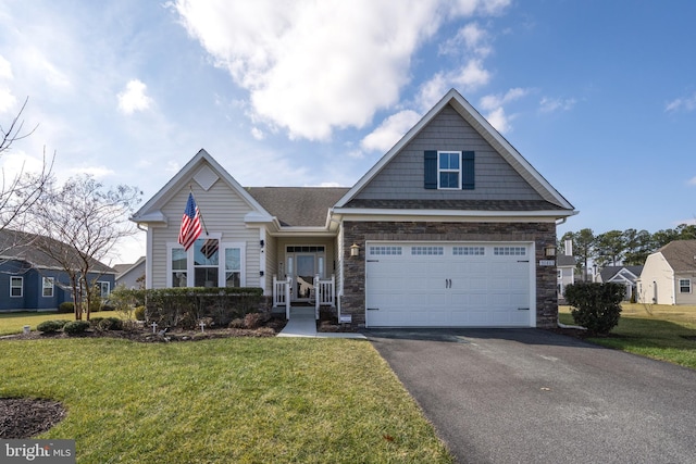 view of front facade featuring a garage and a front lawn