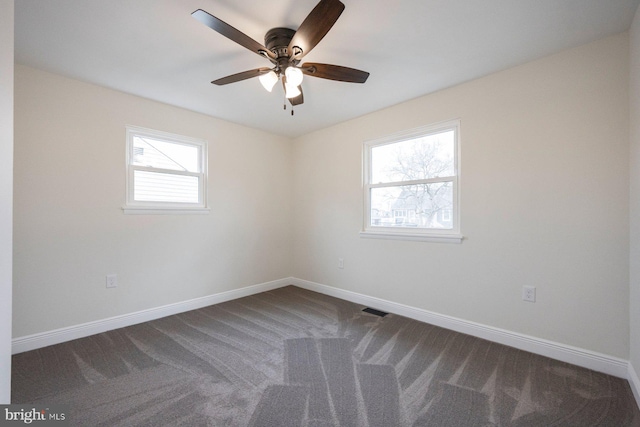 carpeted empty room with ceiling fan