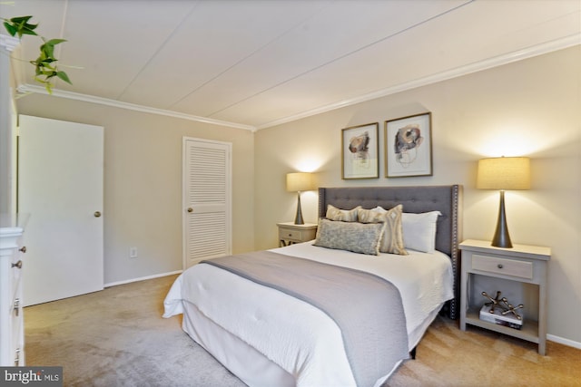 bedroom with light carpet, crown molding, and a closet