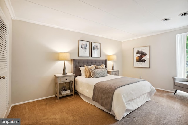 bedroom with crown molding and carpet