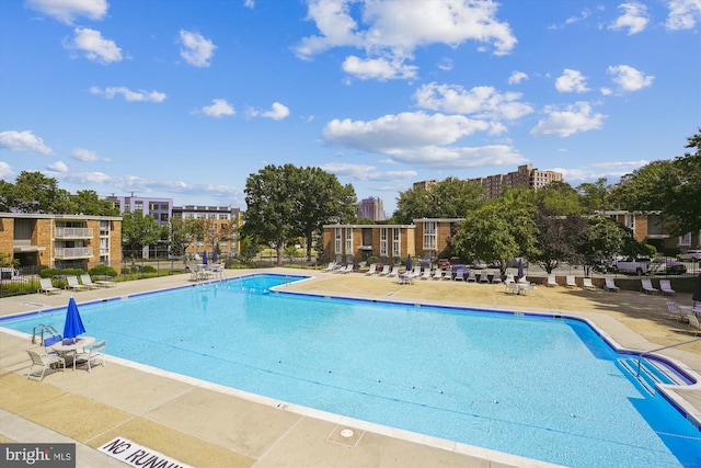 view of swimming pool with a patio