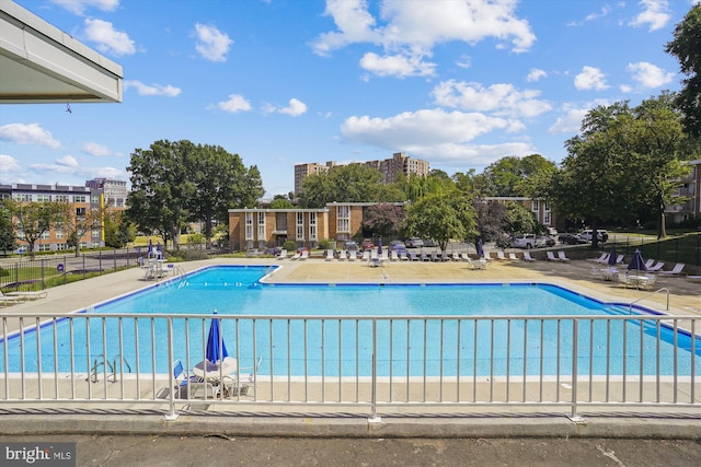 view of swimming pool with a patio