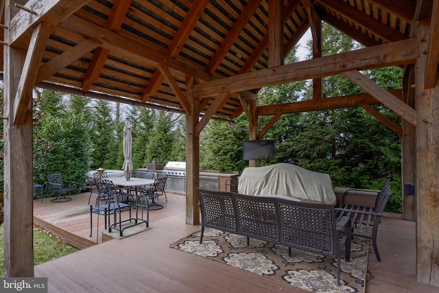 deck with exterior kitchen and area for grilling