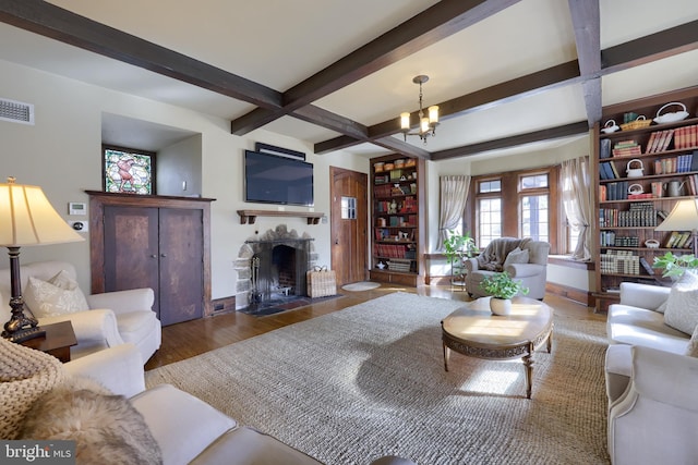 living room with dark hardwood / wood-style flooring, beam ceiling, coffered ceiling, and a chandelier