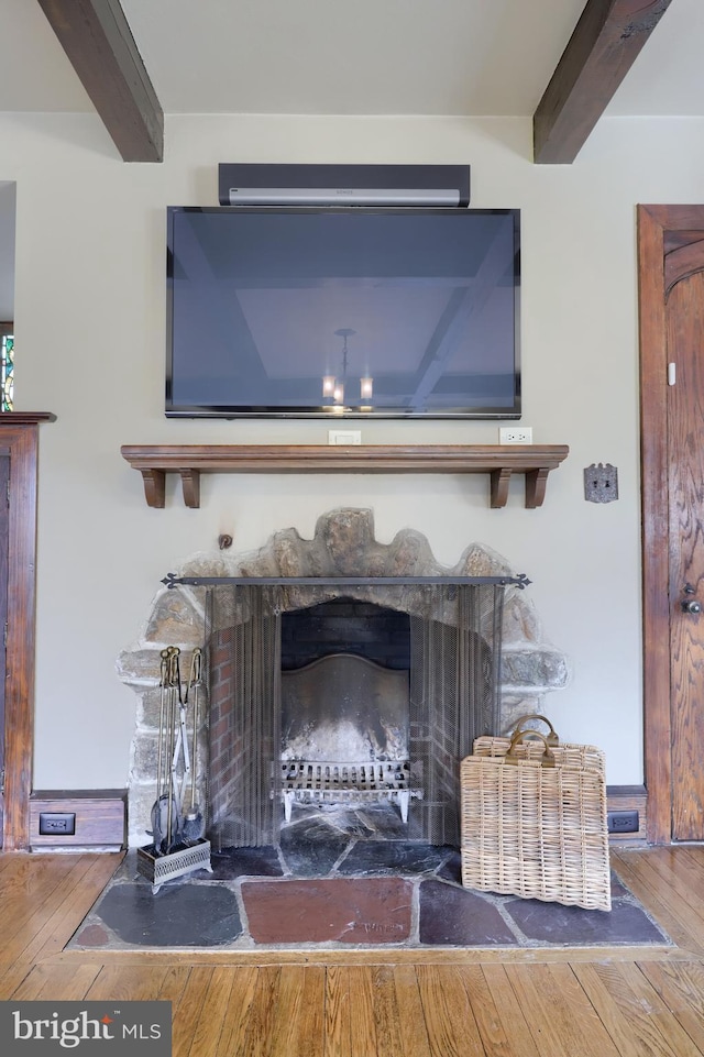 interior details with beamed ceiling and wood-type flooring