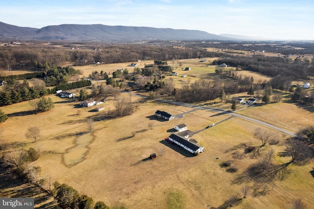 drone / aerial view with a mountain view and a rural view