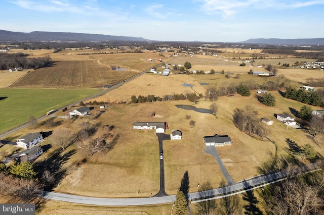 aerial view with a mountain view and a rural view